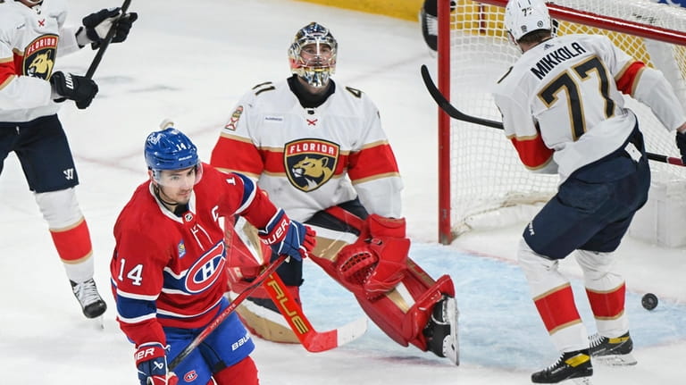 Montreal Canadiens' Nick Suzuki (14) scores against Florida Panthers goaltender...