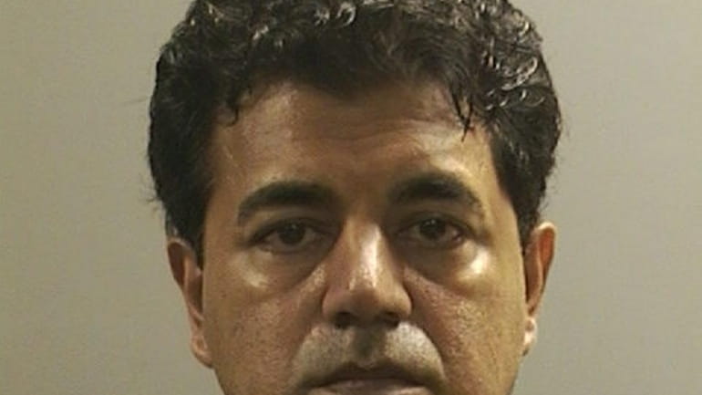 Bethpage pediatrician Rakesh Punn was indicted on charges that he...