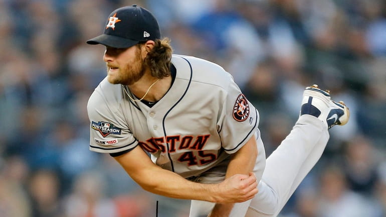 Gerrit Cole of the Houston Astros pitches during Game 3...