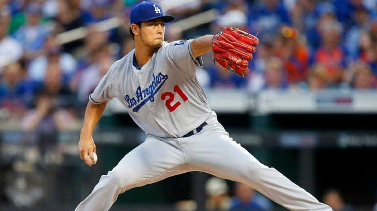 Yu Darvish #21 of the Los Angeles Dodgers pitches in...