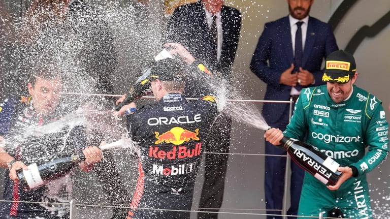 First place, Red Bull driver Max Verstappen of the Netherlands,...
