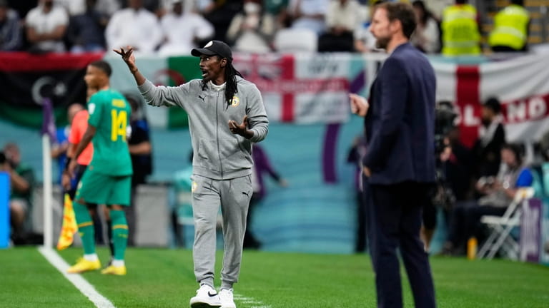 Senegal's head coach Aliou Cisse and England's head coach Gareth...