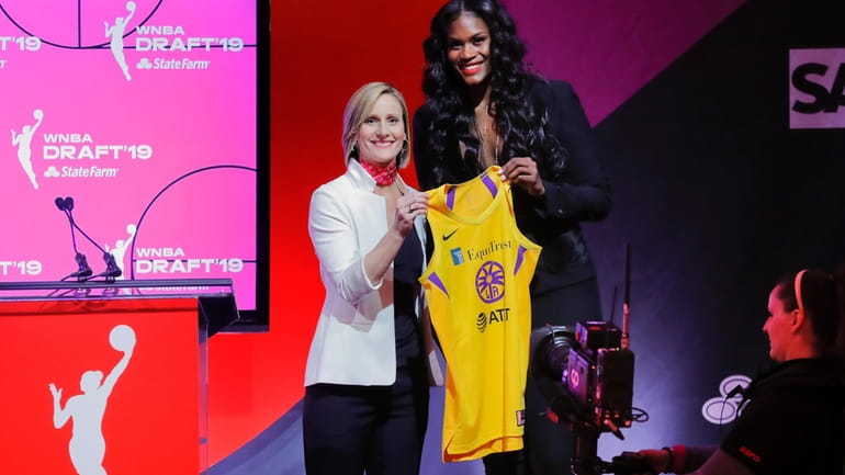 Baylor's Kalani Brown, right, poses for a photo with WNBA...