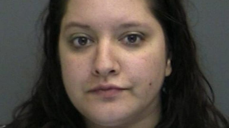 Diana Marini was charged with robbery in the first degree...