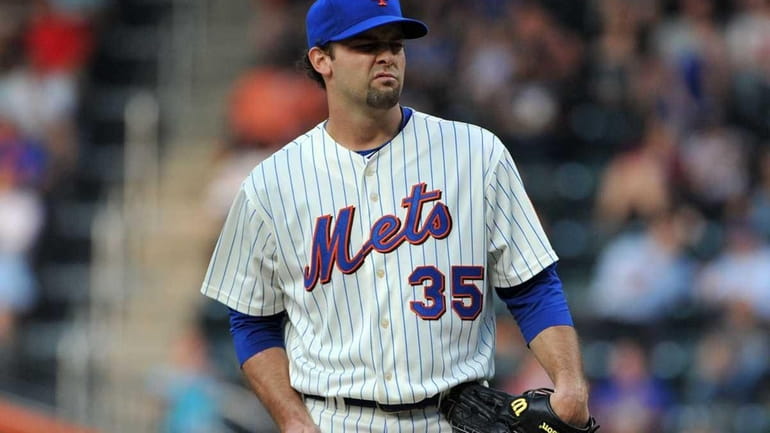 New York Mets starting pitcher Dillon Gee (35) reacts to...