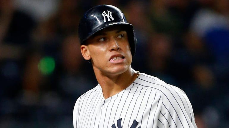 Aaron Judge #99 of the New York Yankees strikes out...