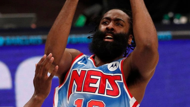James Harden of the Nets puts up a shot late...