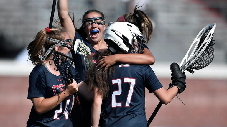 Cold Spring Harbor players celebrate their win against Honeoye Falls-Lima...