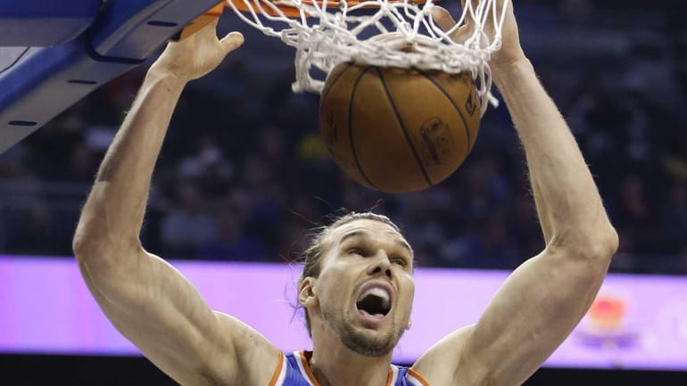 New York Knicks forward Lou Amundson makes an uncontested dunk...