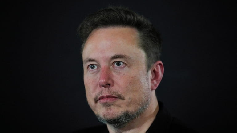 Tesla and SpaceX's CEO Elon Musk looks on, during an...
