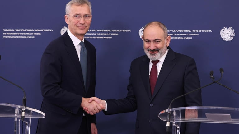 Armenia's Prime Minister Nikol Pashinyan, right, and NATO Secretary General...