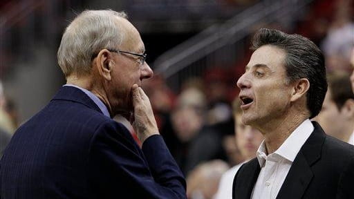 Louisville coach Rick Pitino, right, and his counterpart Syracuse coach...