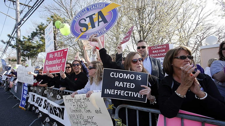 Sayville teachers protest on April 28, 2014, outside a catering...
