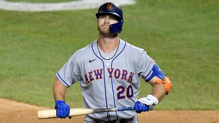 Pete Alonso of the Mets reacts after striking out in...