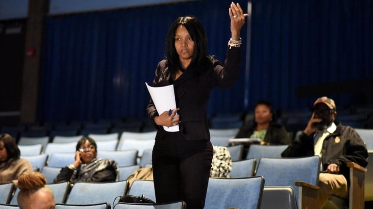 Caprice Rines, a Hempstead resident, airs her concerns following a...