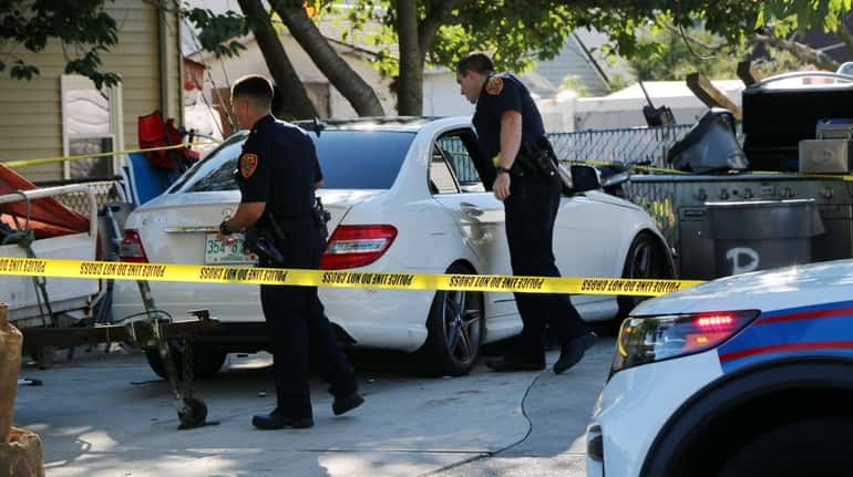 Suffolk County police investigate after two men were shot and injured outside...