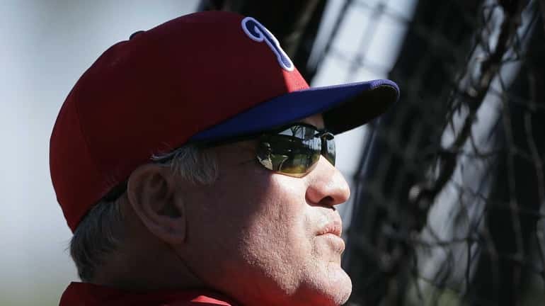 Philadelphia Phillies manager Ryne Sandberg watches his team take batting...