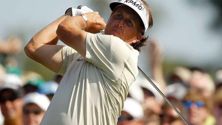 Phil Mickelson of the United States hits a shot during...