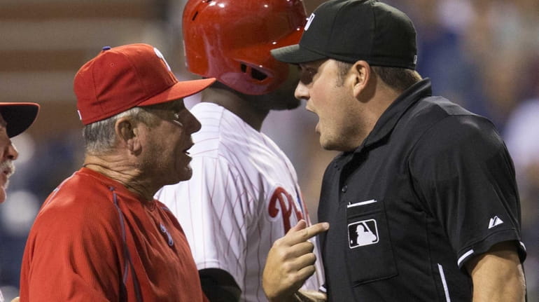 Home plate umpire Dan Bellino ejects Philadelphia Phillies bench coach...