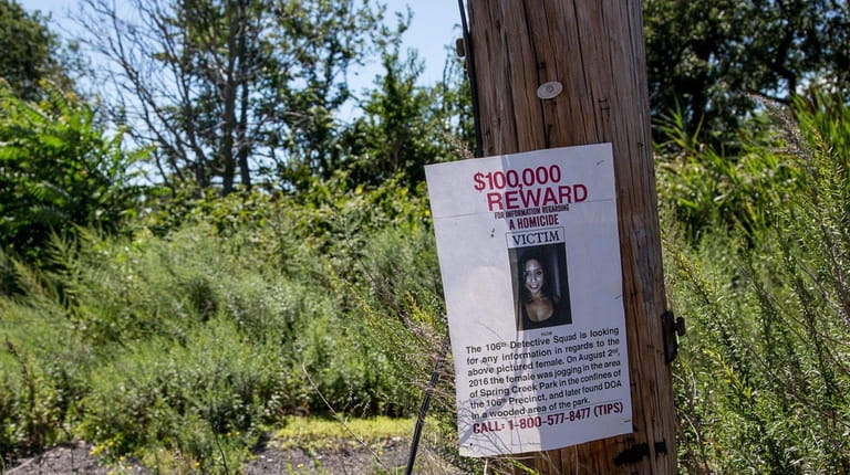 A poster offering a $10,000 reward for information leading to...