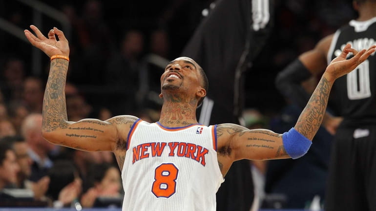 J.R. Smith of the Knicks celebrates after hitting a three...