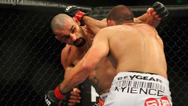 Constantinos Philippou, left, and Court McGee exchange punches during the...