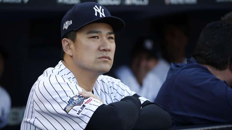 Yankees pitcher Masahiro Tanaka in the dugout in the bottom...