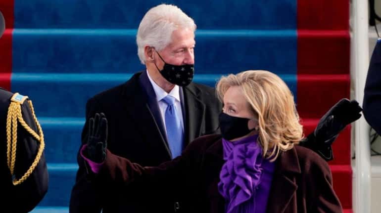 Former President Bill Clinton arrives with former Secretary of State Hillary...