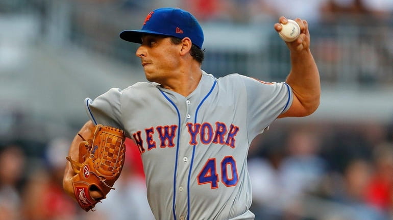 Mets' Jason Vargas delivers a pitch in the first inning...