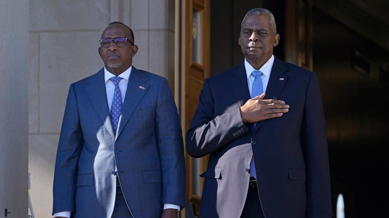 Defense Secretary Lloyd Austin, right, and Kenya's Defense Minister Aden...