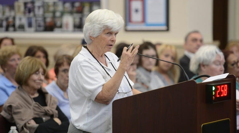 Glen Cove resident Maureen Tracy speaks against the proposed Garvies...