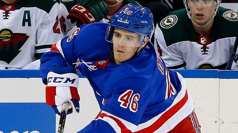 Rob O'Gara of the Rangers shoots the puck during the...