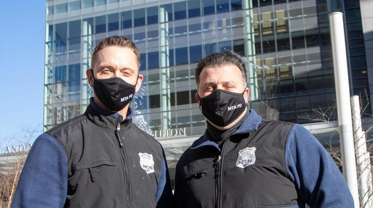 From left, MTA police officers Tom Merkle, left,and John Matarazzo,...