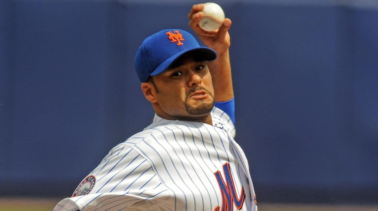 Johan Santana pitches against the Brewers at Shea Stadium on April...