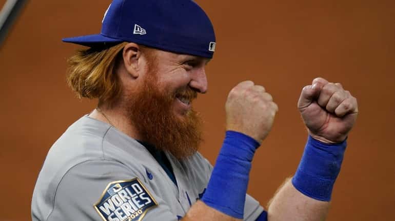 Dodgers third baseman Justin Turner celebrates their win against the...
