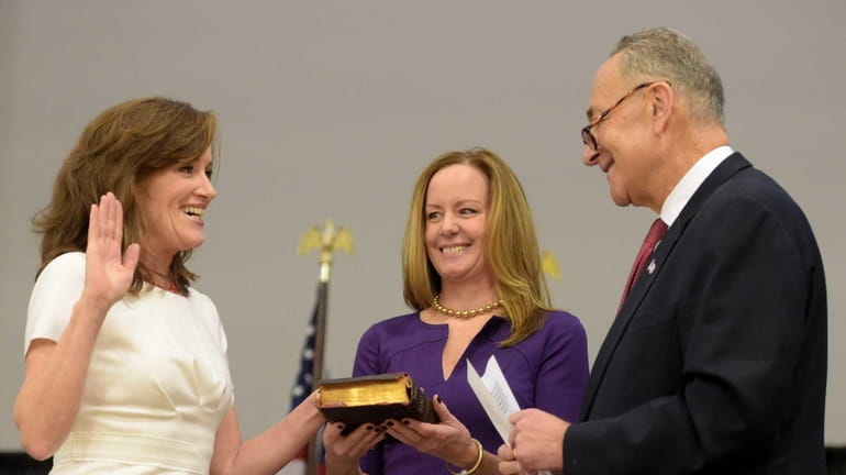 Rep. Kathleen Rice takes the oath of office administered by...