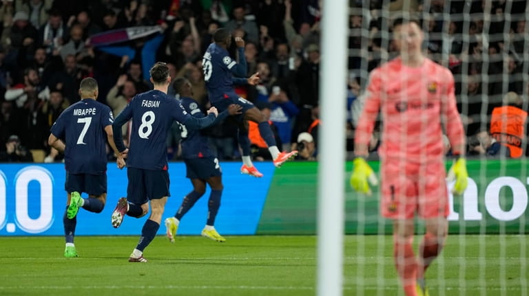 PSG's Ousmane Dembele, right, celebrates after scoring his side's opening...