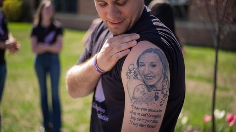 Rachel Quinn's husband, Nathan, displays a tattoo that features his...