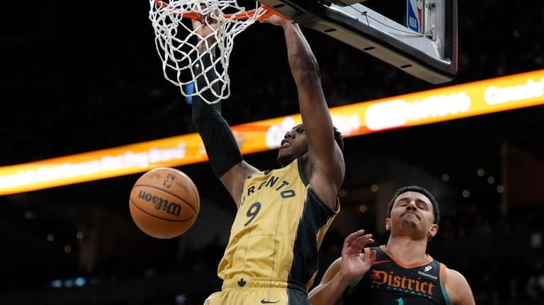 Toronto Raptors guard RJ Barrett (9) dunks as Washington Wizards...