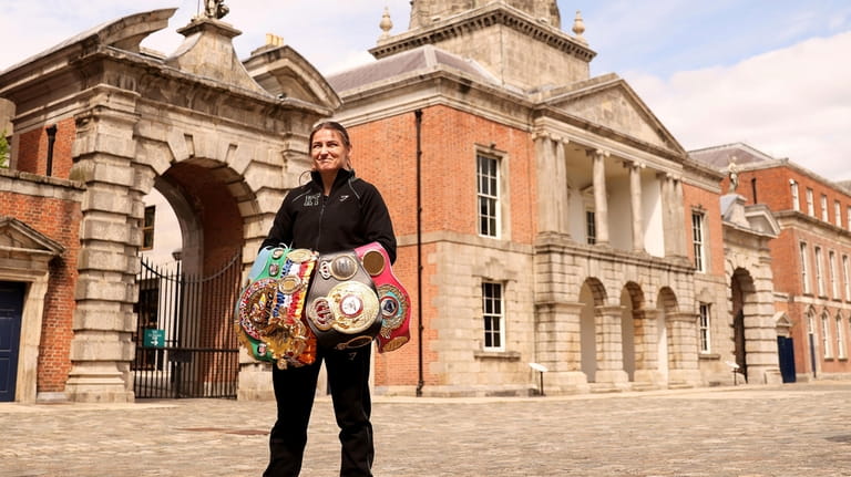 Ireland's Katie Taylor, the undisputed Lightweight champion, poses with her...