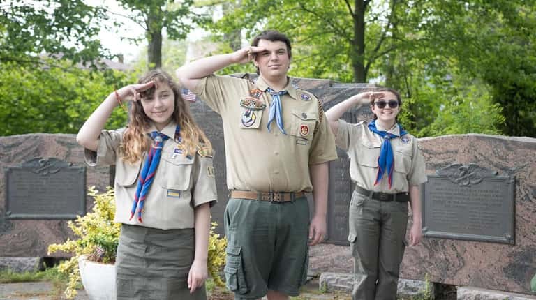 Scouts Scarlett Conn, left, of Troop 163, Evan Conn of...