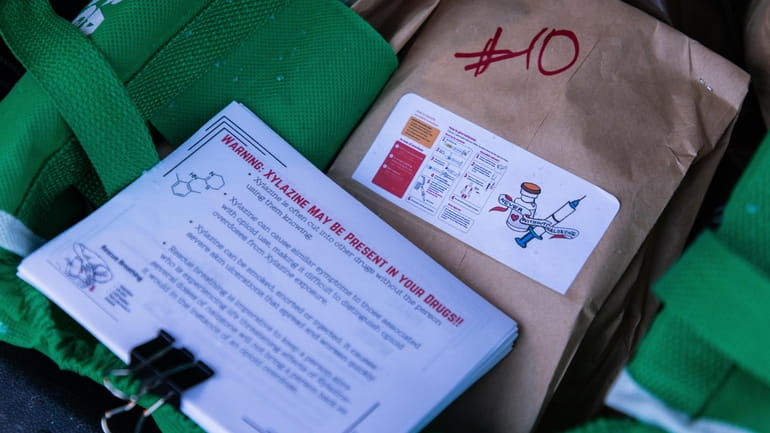 A naloxone kit and flyers about the dangers of xylazine,...