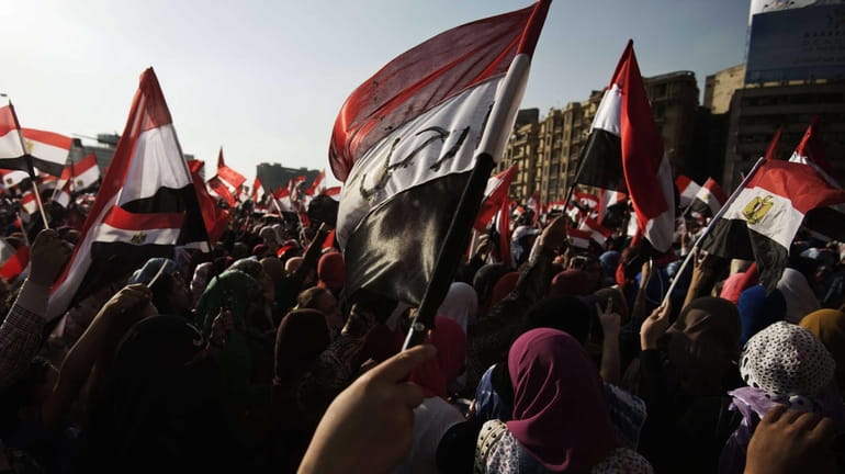 Egyptian opposition protesters celebrate in Cairo's landmark Tahrir square after...