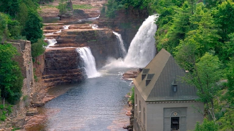 Walk scenic trails by river in Ausable Chasm in the...