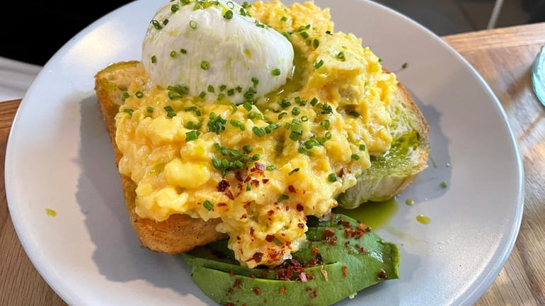 Soft scrambled eggs on toast with burrata, avocado and basil...