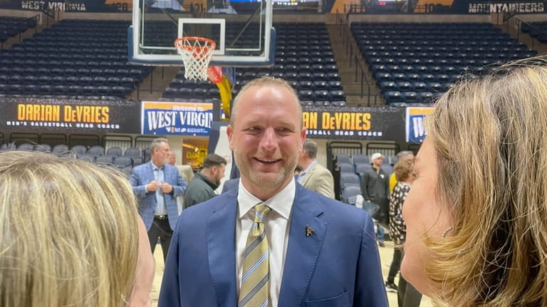 New West Virginia men's NCAA college basketball coach Darian DeVries...