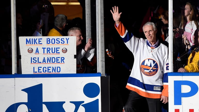 Hall of Famer and former Islander Mike Bossy waves to...