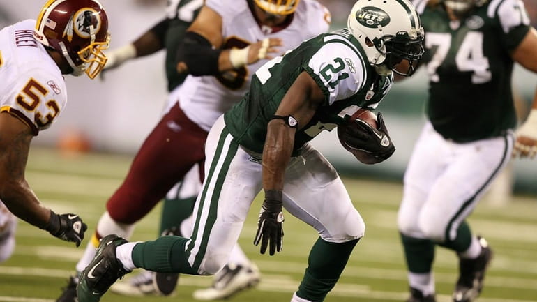 LaDainian Tomlinson #21 of the New York Jets in action...