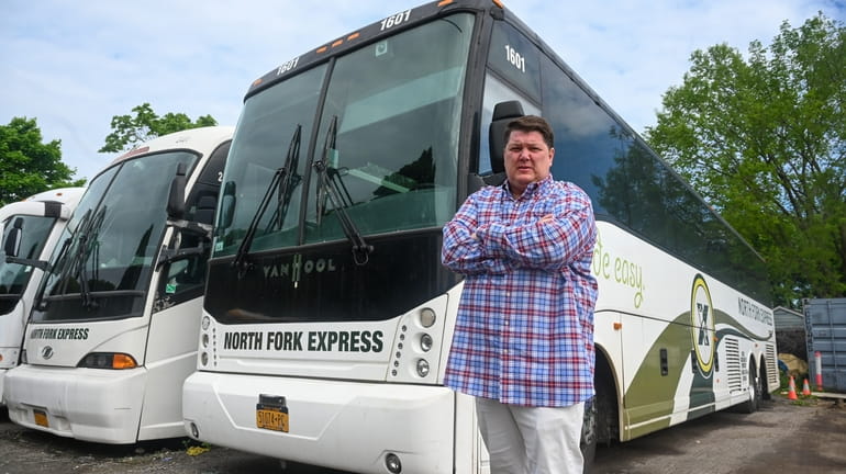 Greg Mensch, owner of North Fork Express buses, at the...