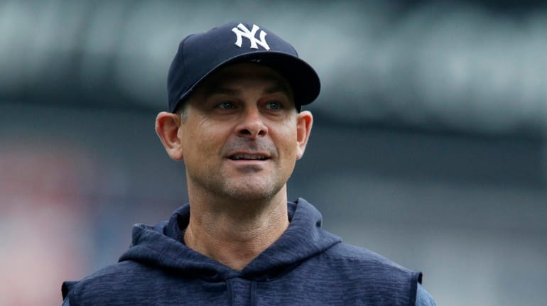 Manager Aaron Boone #17 of the New York Yankees looks...